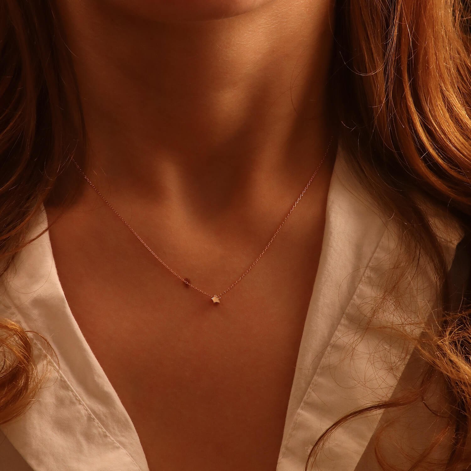 Gold chain with a "Star" pendant on the neck