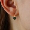 Gold earrings with green zircons