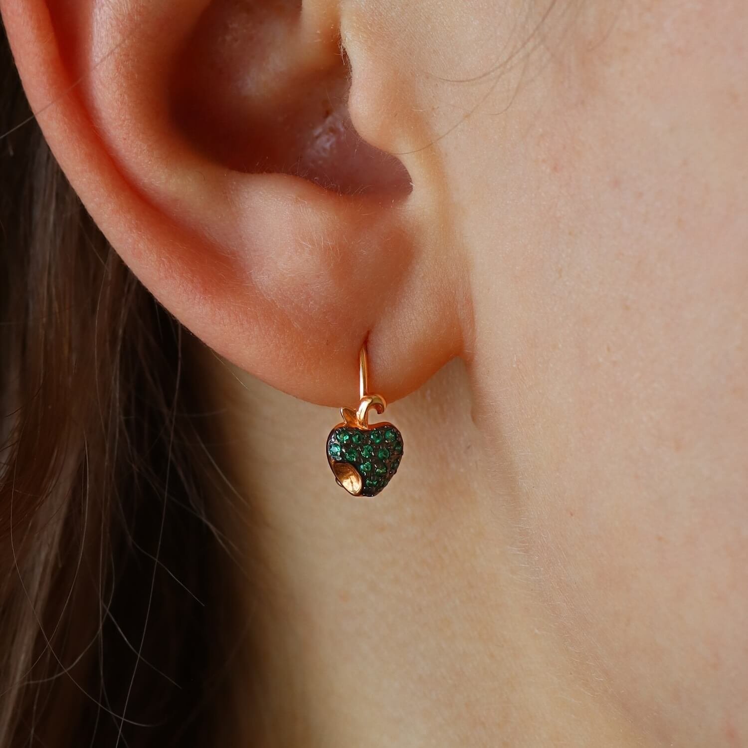 Gold earrings with green zircons